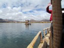 Riding in large totora reed boat