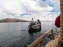Riding in smaller totora reed boat