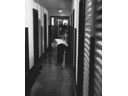Houseboy cleaning hallway